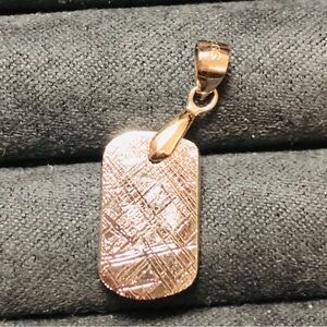 Muonionalusta meteorite pendant. Sterling silver bail marked S925.